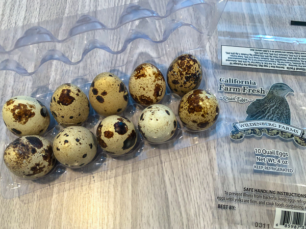 10 quail eggs in a carton