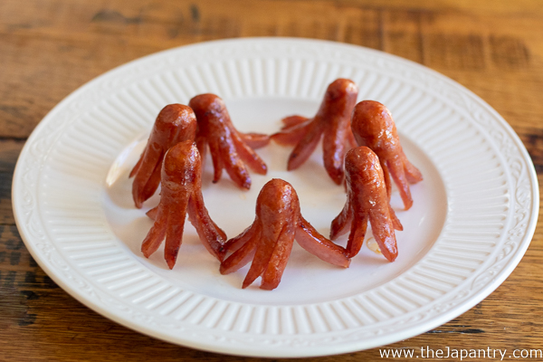 Standing up pan fried sausage octopuses