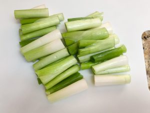 Green onion cut to make Japanese grilled chicken skewers