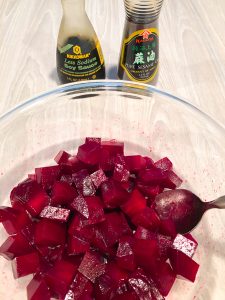 Cubed beets marinating in soy sauce and sesame oil