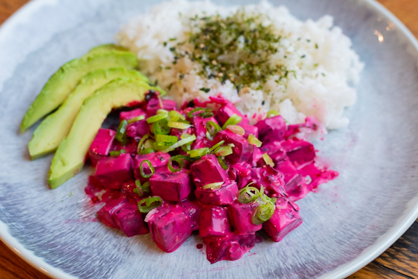 Spicy beet poke with mayo on the plate with avocado and rice
