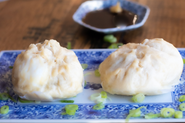Steamed pork buns with soy dipping sauce
